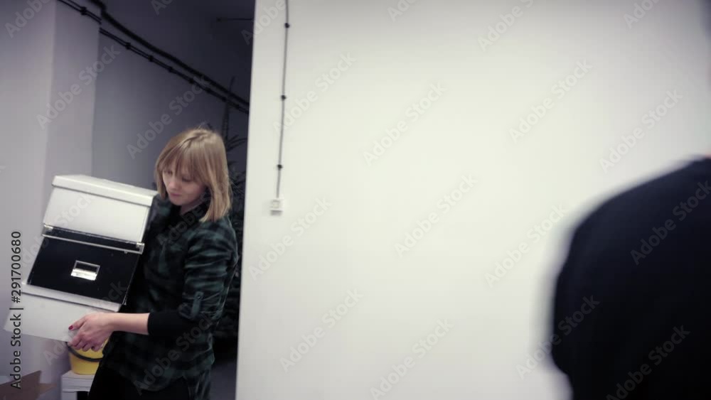 Woman with man moving cardboard boxes Woman with man moving cardboard boxes