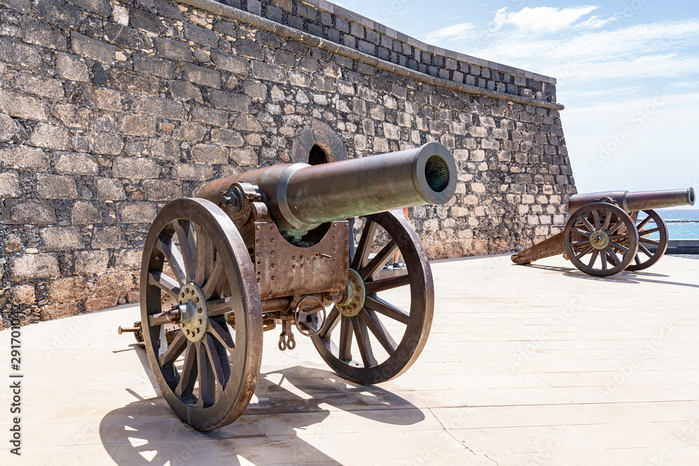 Multiple cannons the old fortress (Castillo de San Gabriel), off the coast from Arrecife, Lanzarote, Spain Multiple cannons the old fortress (Castillo de San Gabriel), off the coast from Arrecife, Lanzarote, Spain