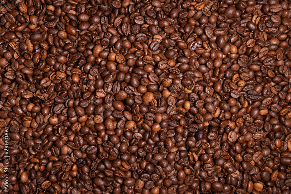Fresh roasted coffee beans background. Overhead view. Fresh roasted coffee beans background. Overhead view.