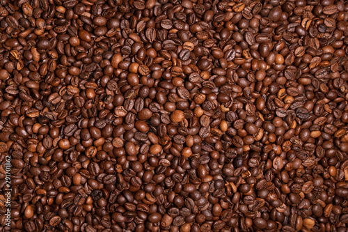 Fresh roasted coffee beans background. Overhead view.