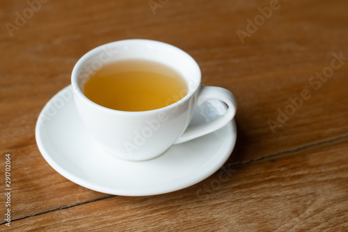 Hot tea cup on wood table