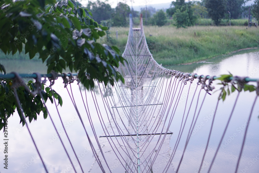 Obraz premium rope bridge in park
