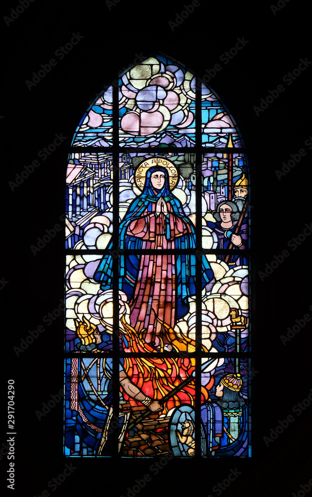 Saint Apollonia, stained glass windows in the Saint Laurent Church, Paris, France 