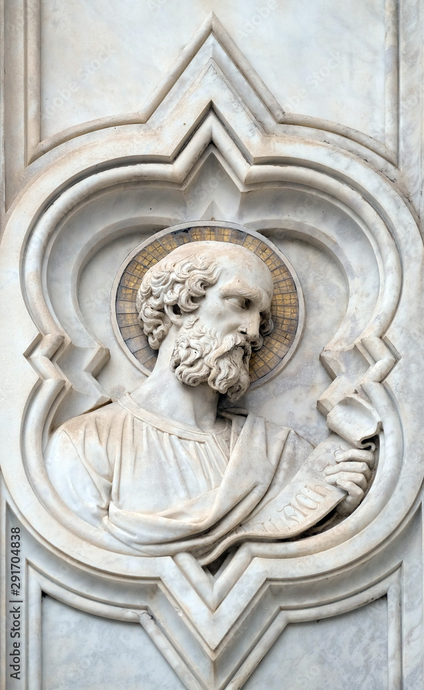 Saint, relief on the facade of Basilica of Santa Croce (Basilica of the Holy Cross) - famous Franciscan church in Florence, Italy