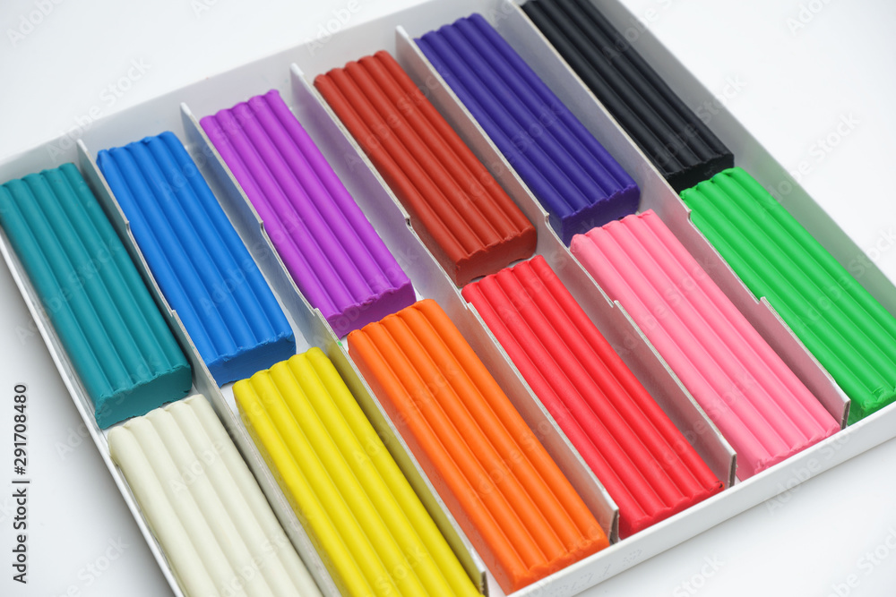Obraz premium Multi-colored plasticine sticks in a cardboard box.
