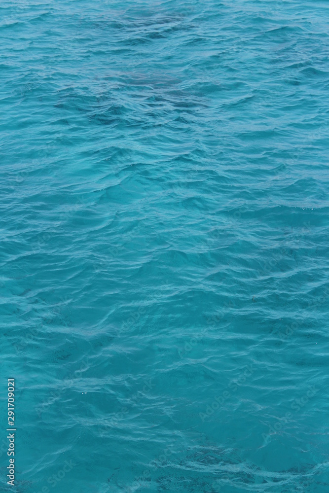 transparent pale blue azure water in the sea