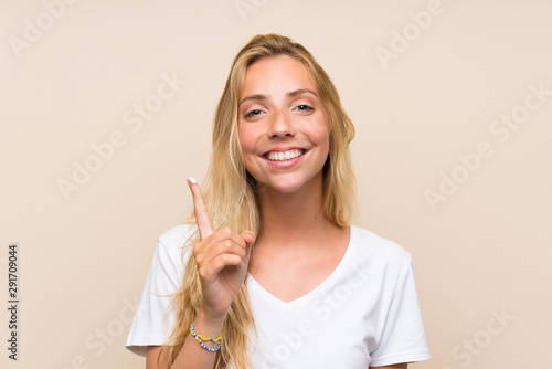Happy Young blonde woman with moisturizer