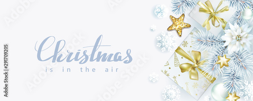 Christmas composition with spruce branches and gift boxes on white background