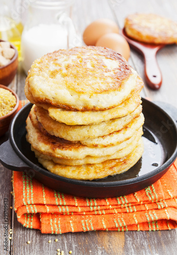 Millet pancakes in a frying pan
