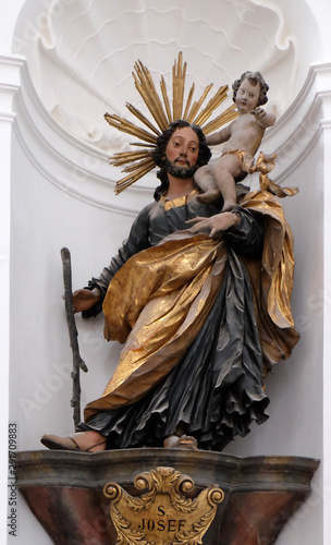 Saint Joseph holding baby Jesus, Altar in Collegiate church in Salzburg