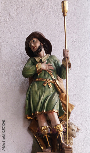 Statue of Saint in the Saint Lawrence church in Kleinostheim, Germany photo