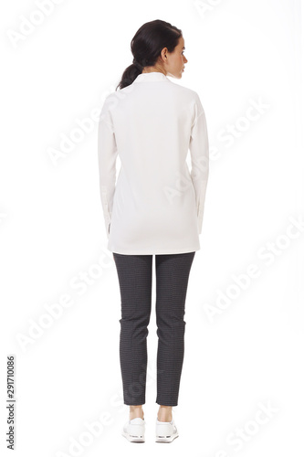 brunette indian business woman in formal official white blouse trousers trainers shoes full body photo