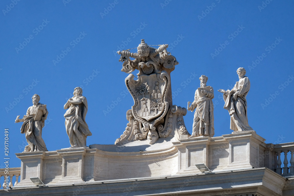 Obraz premium St. Mark Evangelist, Mary of Egypt, Alexander VII Coat of Arms, Ephraim and Theodosia of Tyre, fragment of colonnade of St. Peters Basilica. Papal Basilica of St. Peter in Vatican, Rome, Italy. 