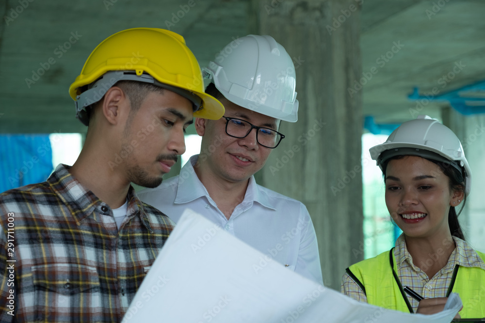 Engineers are discussing at building site Engineers are discussing at building site