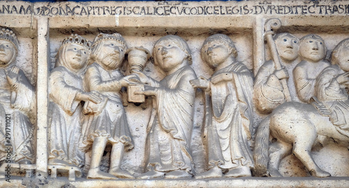 Scenes from the life of St. Geminianus : Geminianus  receives the gift of the Byzantine emperor Jovian, bass relief by Wiligelmo, Modena Cathedral, Italy photo