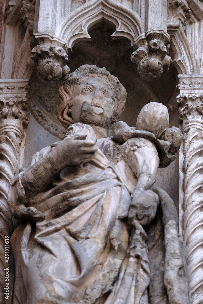 Statue on the Porta della Carta, detail of the Doge Palace, St. Mark Square, Venice, Italy