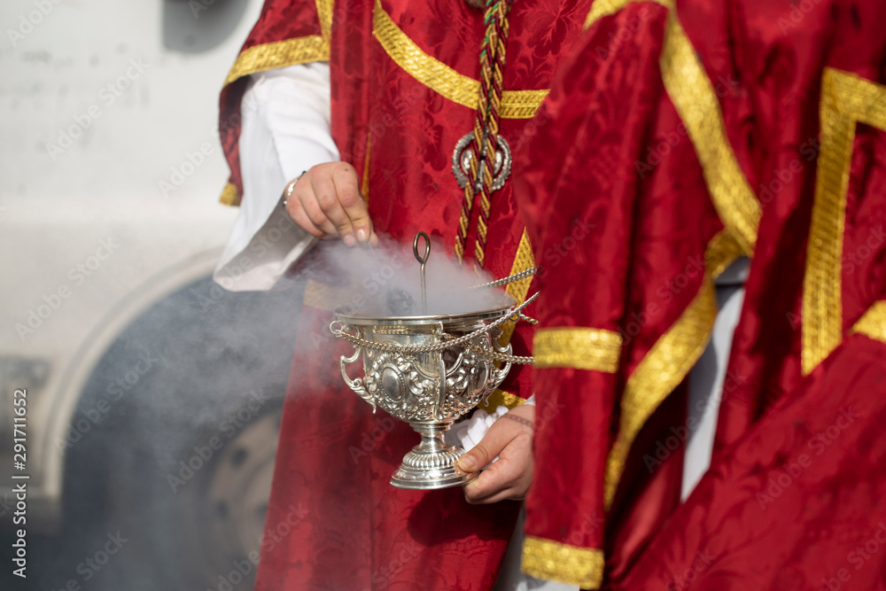 Child holding a censer in a procession, Holy Week