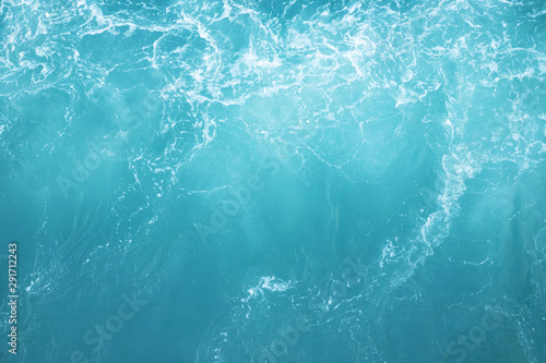 Sea Waves in ocean wave Splashing Ripple Water. Blue water background. Leave space to write a description of the message.
