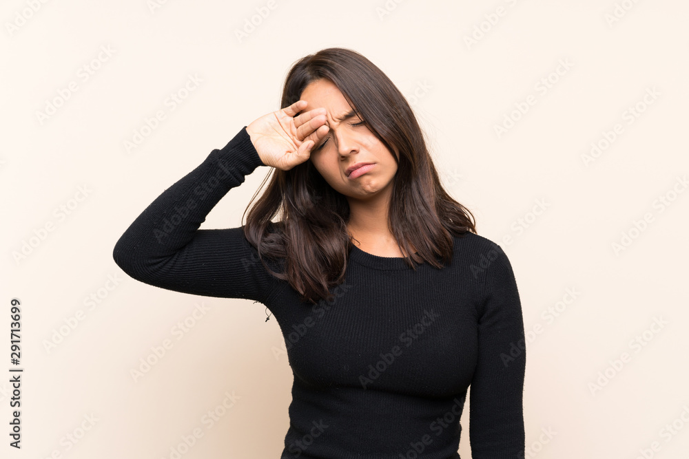 Young brunette woman with white sweater over isolated background with tired and sick expression Young brunette woman with white sweater over isolated background with tired and sick expression