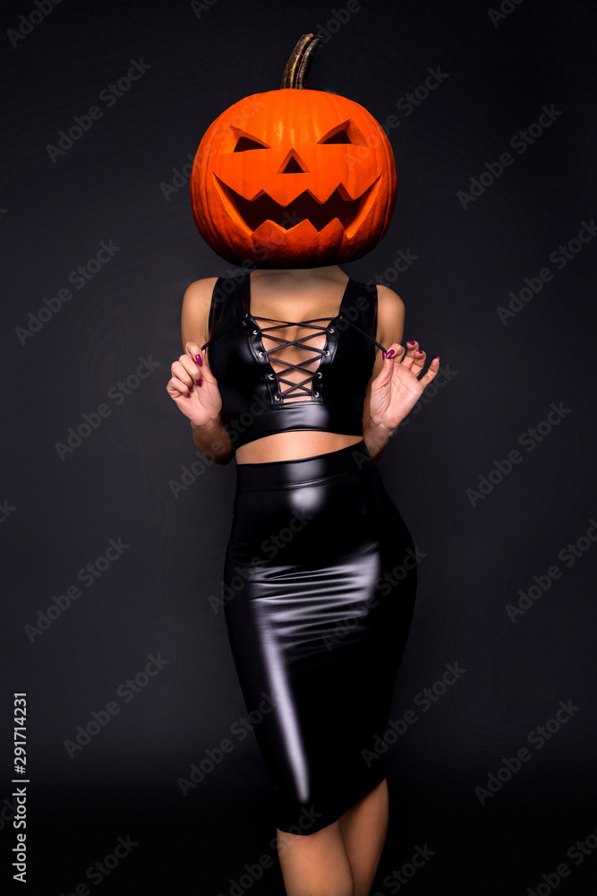 Halloween sexy model with a pumpkin on her head. Beautiful young woman in  sexy lingerie. Wide Halloween party design - picture Stock Photo | Adobe  Stock