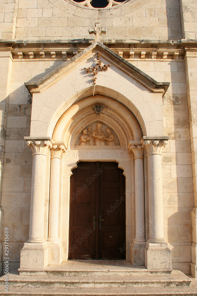 Entrance portal of the Church of Blessed Virgin of Purification in Smokvica, Korcula island, Croatia Entrance portal of the Church of Blessed Virgin of Purification in Smokvica, Korcula island, Croatia