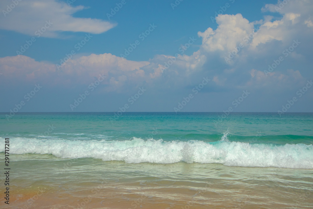 Blue skies beautiful white waves at Karon beach in phuket