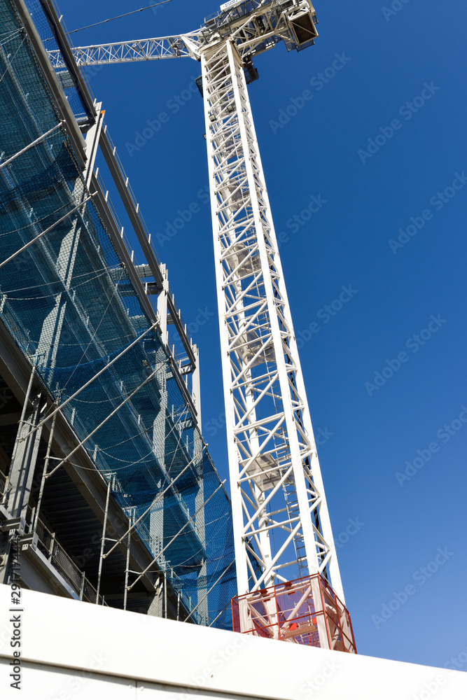 Construction Crane in operation working on Steel framed building.