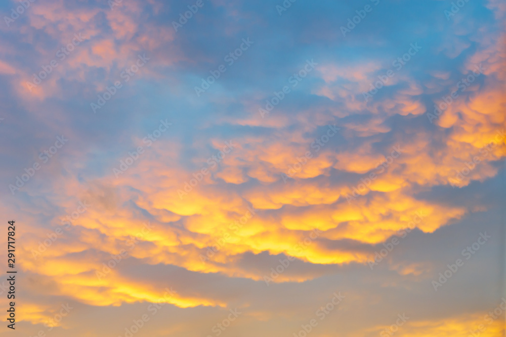 Colorful dramatic sky with clouds at sunset or sunrise