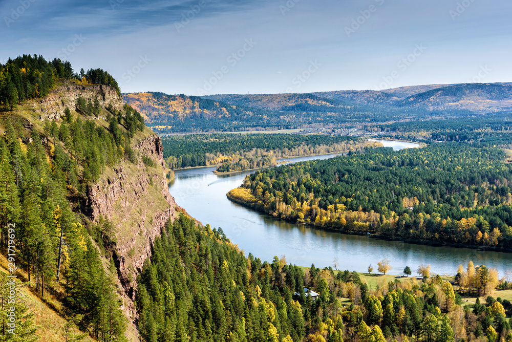 River, rock and autumn forest. View from above. River, rock and autumn forest. View from above.