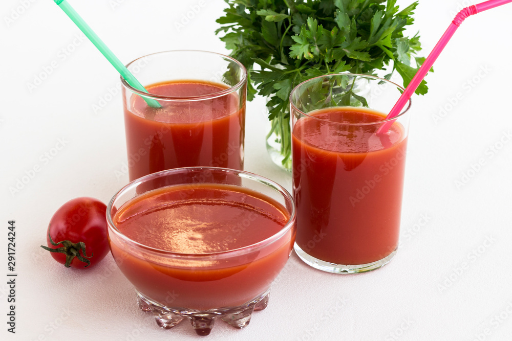 Tomato juice, tomato, bunch of green parsley on a white background Tomato juice, tomato, bunch of green parsley on a white background