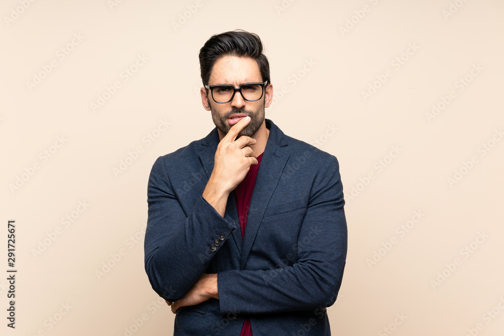 Handsome young man over isolated background thinking Handsome young man over isolated background thinking