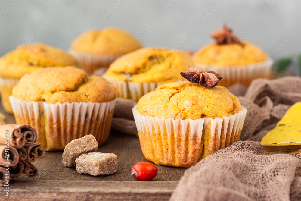 Sweet pumpkin or carrot muffins with fall spices. Autumn dessert. Healthy baking concept. Copy space. Sweet pumpkin or carrot muffins with fall spices. Autumn dessert. Healthy baking concept. Copy space.