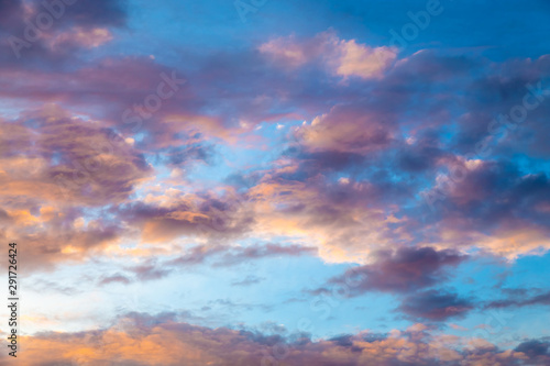 Colorful image of dramatic cloudscape. Amazing clouds of pink, purple, violet, white, gray color on the background of the evening dark sky after sunset. © udovichenko