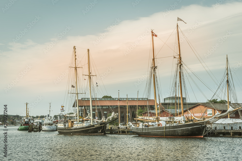 Old sailingboats at a jetty in the port of Svendborg