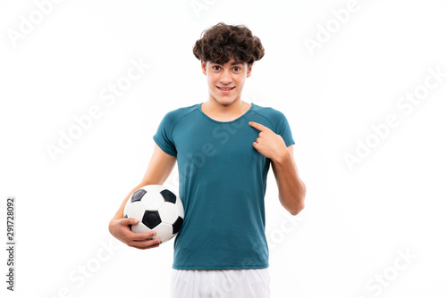 Young football player man over isolated white wall with surprise facial expression © luismolinero