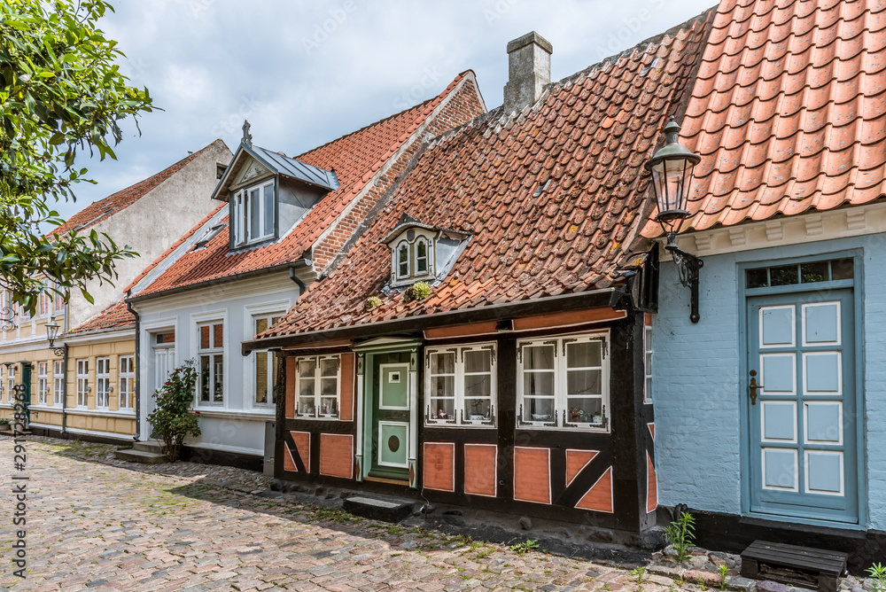 A romantic fairytale halftimbered house on a cobblestone street