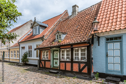A romantic fairytale halftimbered house on a cobblestone street photo
