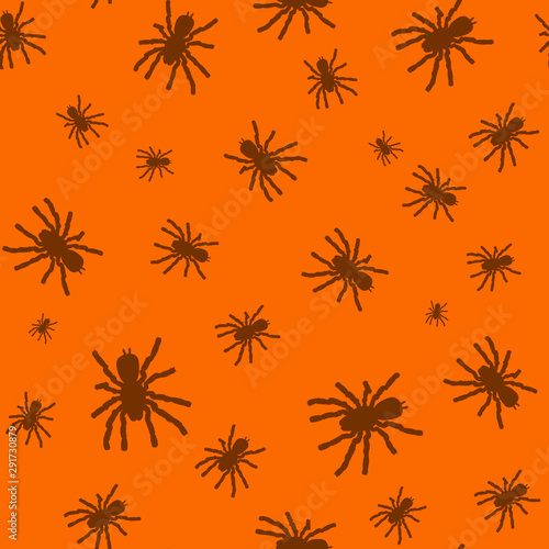 Seamless pattern with black silhouette of spider on orange background. Halloween decorative texture. Pattern for design, web, wrapping paper, fabric.