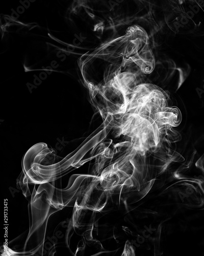 Mystery dense smoke over black background, abstract photo