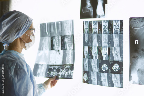 Two female women medical doctors looking at x-rays in a hospita