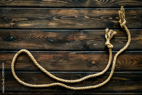 Fototapeta Naklejka Na Ścianę i Meble -  rope frame on wooden background top view mock-up