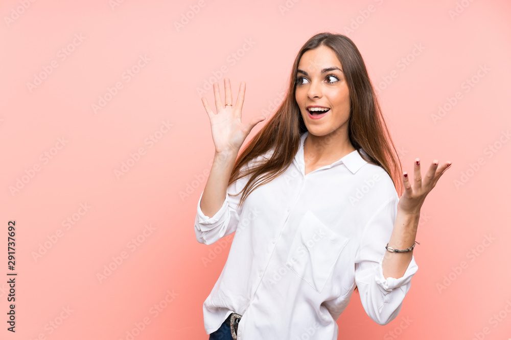 Young woman over isolated pink background with surprise facial expression Young woman over isolated pink background with surprise facial expression