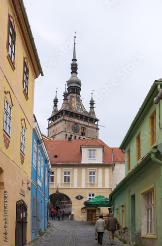 The Turnului street is leading to the entrance to the old town in Sighisoara city in Romania photo