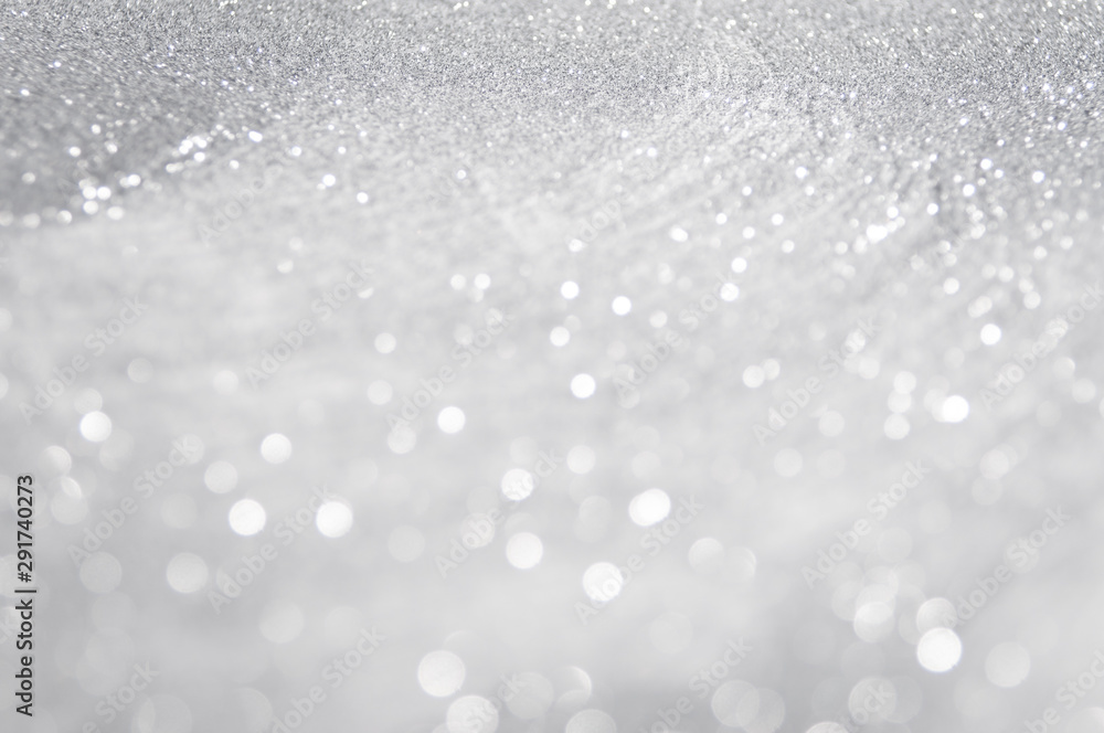 Abstract of Bright and sparkling bokeh background. silver and diamond dust bokeh blurred lighting from glitter texture Abstract of Bright and sparkling bokeh background. silver and diamond dust bokeh blurred lighting from glitter texture