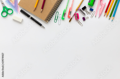 Top view of school supplies on a white background