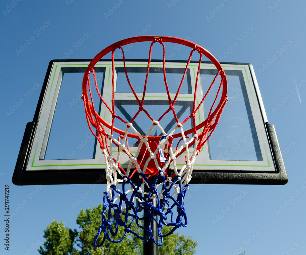 Upwards view of a basketball net and backboard