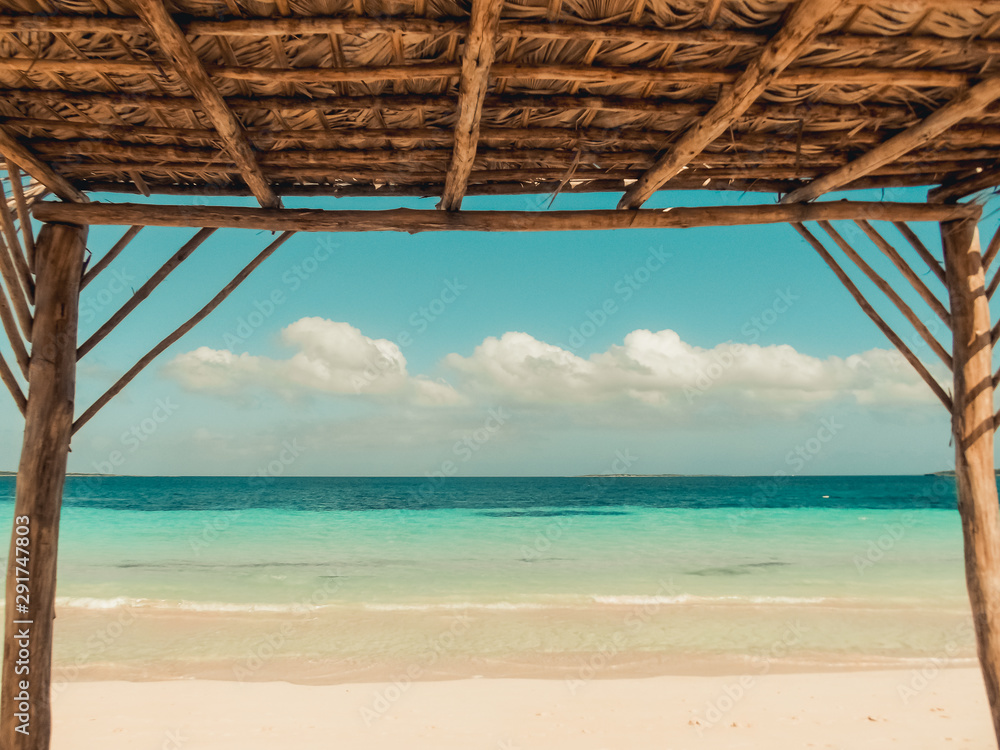 view from a beach cabana on the Caribbean, blue ocean and cloudy sky. A perfect summers day. view from a beach cabana on the Caribbean, blue ocean and cloudy sky. A perfect summers day.