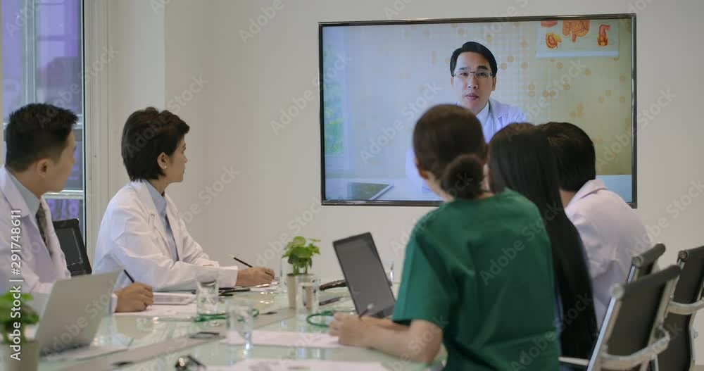 Medical team having an online video conference in meeting room at hospital. Medical team having an online video conference in meeting room at hospital.