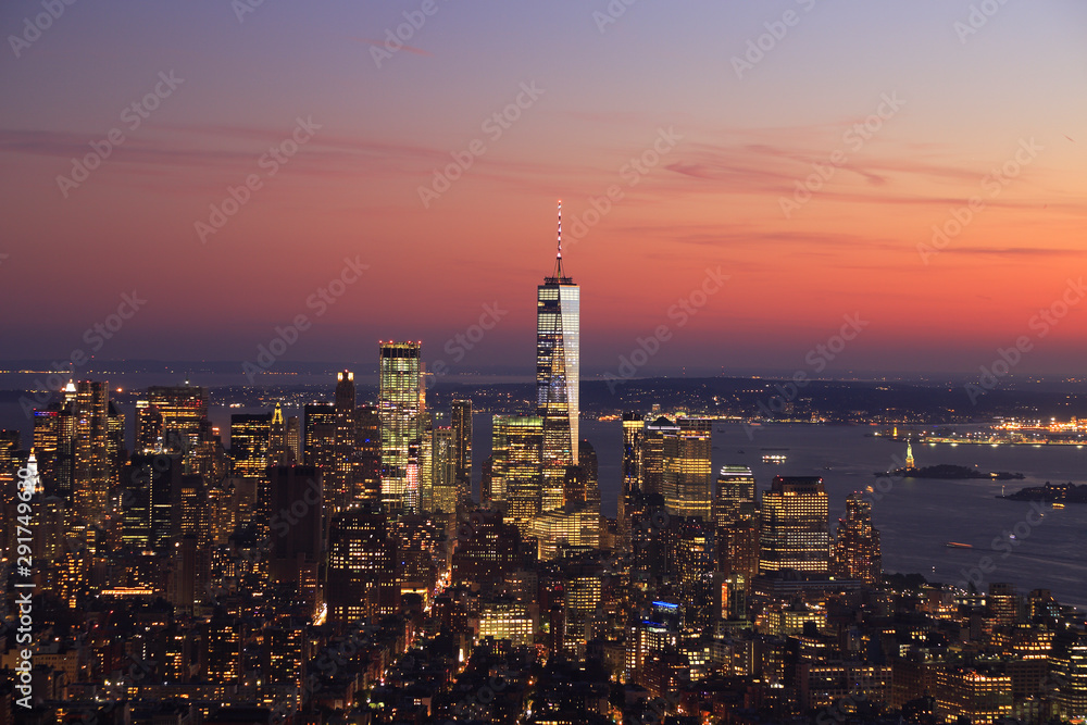 Aerial view of New York City skyline illuminated at sunset, USA