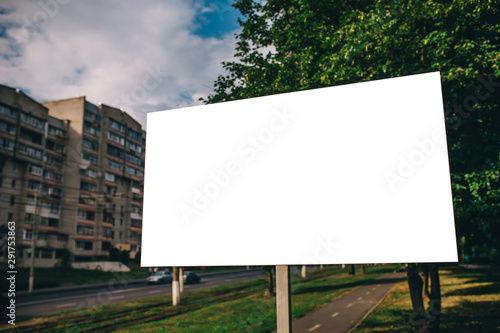 Blank mock up of street poster billboard on city background photo